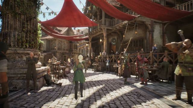 Official trailer frame: a busy market square under red canopies with traders and townsfolk